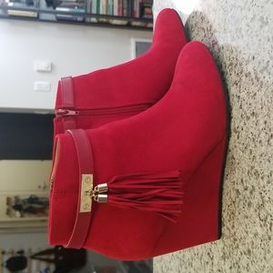Red ankle boots with fringe detail